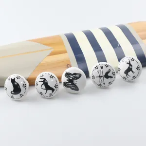 Close-up of cute animal ceramic knobs for children's furniture and drawer handles