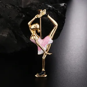 Detailed close-up of an elegant enamel pink ballet girl brooch with golden accents