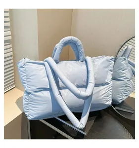 Fashionable light blue padded space cotton tote bag with quilted texture and soft straps