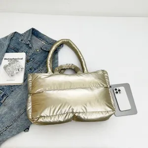 Stylish champagne gold puffy space cotton handbag with minimalist fashion design for women