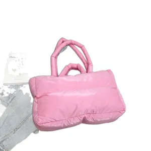 Trendy pink padded puffer tote bag made of soft quilted space cotton material for winter