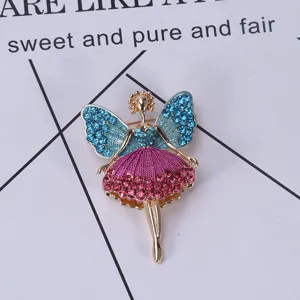 Macro view of a sparkling ballerina fairy brooch with blue and pink rhinestones