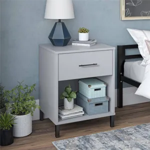 Close-up of modern black long bar handle on a minimalist grey furniture drawer.