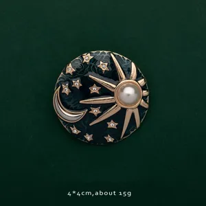 Detailed view of celestial sun moon and stars brooch with pearl and crystals
