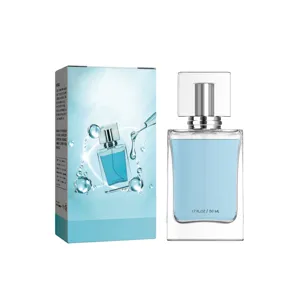 Clear square glass perfume bottle with light blue liquid and luxury gift box packaging.