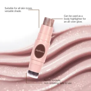 Detailed view of champagne pink dual-ended highlighter stick with brush and creamy texture