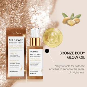 Close-up of OceAura Bronze Body Glow Oil bottle with packaging and argan oil detail