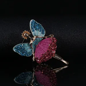 Detailed view of an elegant ballerina brooch featuring butterfly wings and crystals