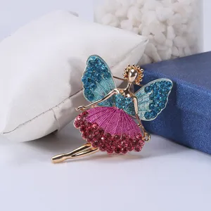 Detailed macro shot of an elegant ballet girl brooch featuring blue and pink rhinestones