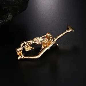 Detailed back view of gold enamel ballet dancer brooch showing the secure pin clasp