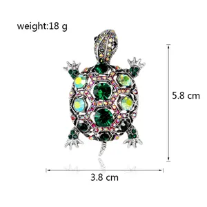 Vintage turtle brooch detailed view with green rhinestones, size 5.8 cm by 3.8 cm