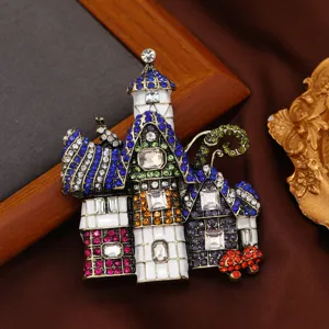 Broche château ornée de strass colorés et détails en émail blanc