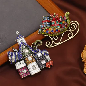 Ensemble de broches château de Noël et traîneau coloré pour cadeaux de fin d'année.
