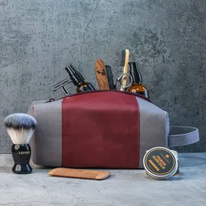 Large vintage canvas and leather toiletry bag for men showing shaving grooming kit