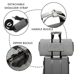 Detail view of gray travel bag featuring detachable strap and luggage sleeve