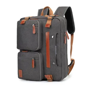 Vista detallada de la mochila de negocios de lona gris con cuero marrón y múltiples bolsillos
