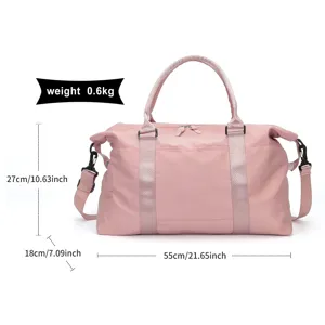 Pink travel duffel bag dimensions 55x18x27cm shown with metric and imperial units