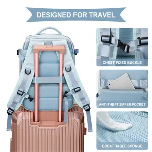 Detail view of blue travel backpack features including luggage strap and anti-theft pocket.