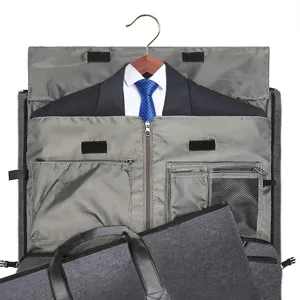 Detail view of the interior storage compartment of a gray garment travel bag for suits.