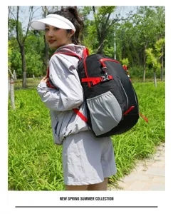 Casual outdoor backpack with red straps and mesh side pockets, durable daypack for travel.