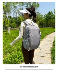 Outdoor travel backpack detail showcasing grey casual design with functional straps and pockets.