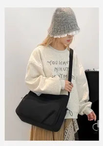 Borsa a tracolla nera in nylon da donna, elegante borsa messenger casual autunnale.