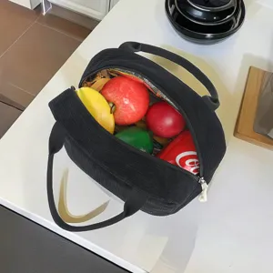 Detailed interior view of a large capacity insulated corduroy lunch bag with fruits.