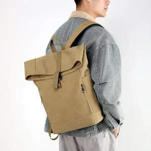 Detailed side view of a khaki canvas roll-top laptop backpack worn by a male model