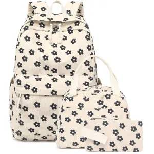 Detailed view of three-piece corduroy set featuring backpack and bags with floral pattern