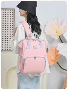 Stylish pink diaper backpack with large capacity for mother and baby travel