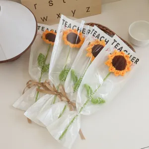 Handmade crochet sunflower bouquet in transparent wrapper, perfect gift for teacher day.