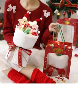 Detail shot of a festive Christmas plush bear bouquet with LED lights and holiday bag