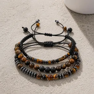 Gros plan d'un ensemble de bracelets en perles d'œil de tigre et lave de 8 mm