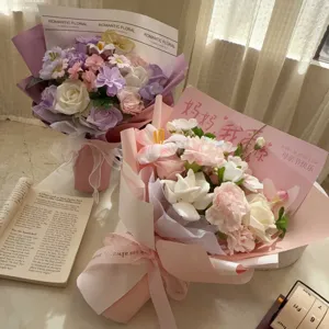 Close-up of soap flower bouquets with romantic floral wrapping and Mother's Day card