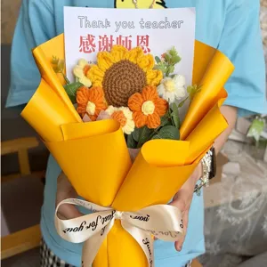 Handmade crochet sunflower bouquet wrapped in bright yellow paper for teacher appreciation gifts.
