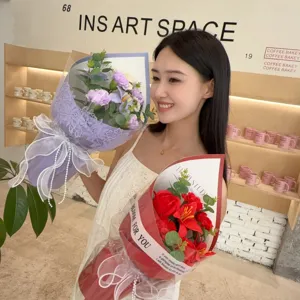 Close-up of elegant soap flower bouquets in purple and red with delicate lace wrapping.