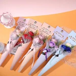 Detailed view of colorful soap rose bouquets with greeting cards and ribbons for teacher's day.