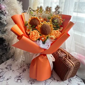 Detailed view of a vibrant hand-knitted sunflower and rose bouquet for graduation gifts.