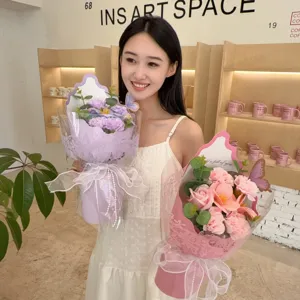Model holding pink and purple soap flower bouquets for Mother's Day gift decoration