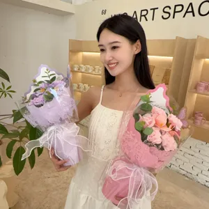 Young woman holding beautiful pink and purple soap rose bouquets for Mother's Day gift