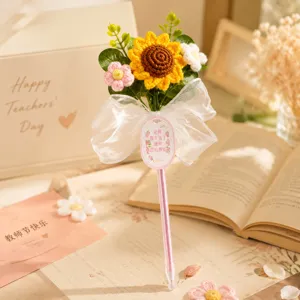 Handmade crochet sunflower gel pen with cute gift bow, perfect teacher day gift stationery.