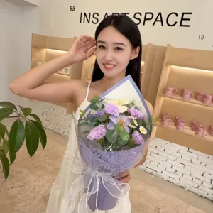 Asian woman holding an elegant purple soap flower bouquet with carnations and lilies