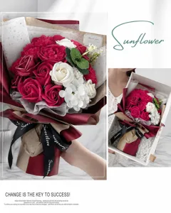 Close-up of red and white carnation soap flower bouquet in an elegant white gift box