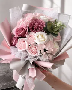 Detailed view of pink rose and carnation soap flower bouquet in elegant wrapping