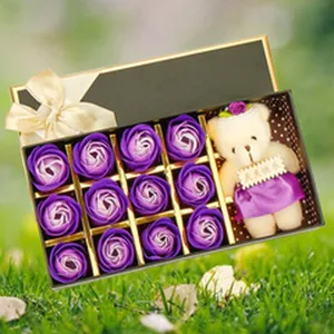 Soap rose flower gift box detail with cute bear doll and ribbon bow for decoration.