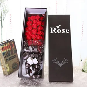Detailed display of the romantic red soap rose bouquet placed inside a chic long gift box.