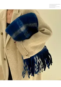 Soft plaid mohair scarf with thick braided tassels, perfect for winter warmth and style.