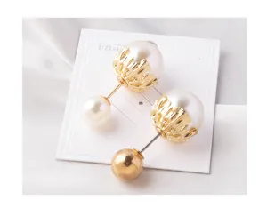 Detailed view of elegant pearl brooch pins on white card against silk background
