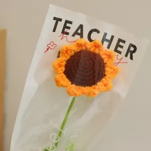 Handcrafted crochet sunflower bouquet with transparent gift packaging bag for teacher gift.