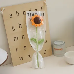Handmade crochet sunflower bouquet in clear gift bag, perfect creative teacher present.